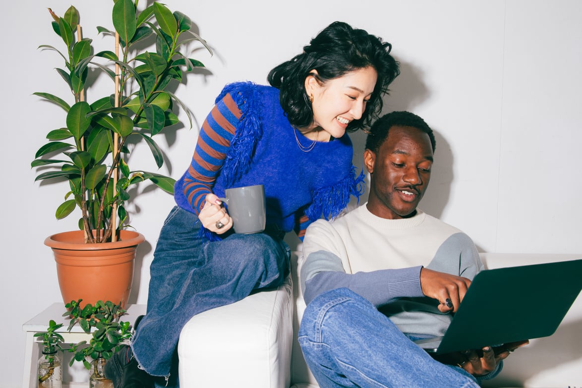 High Flash People Portraits Man and Woman Looking at Laptop